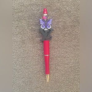 Magenta butterfly logo pen